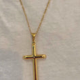 Load and play video in Gallery viewer, Video of 24k gold overlay Figaro chain cross pendant necklace for men and women, featuring a solid plated clasp.
